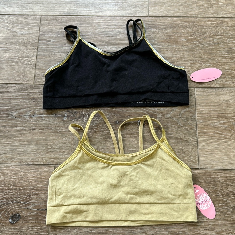 NWT set of 2 Sports bra Dance with four thin metallic straps.